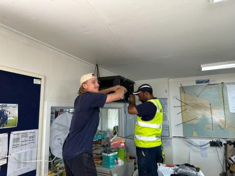 Samuel working in IT in PNG